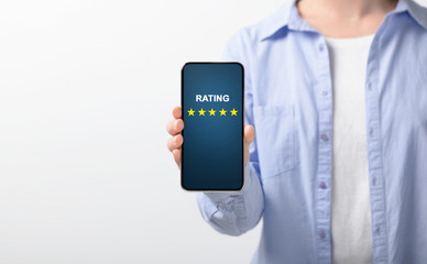 Consumer Showing cell phone with five star for Satisfaction rating