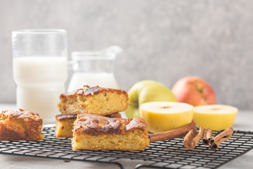 Homemade blondie (blonde) brownies apple cake square slices with glass of milk