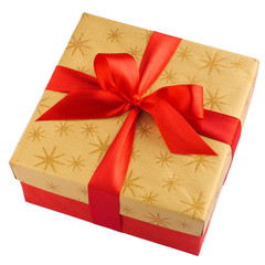 Red gift or present box with golden colored top and red ribbon bow isolated on white background