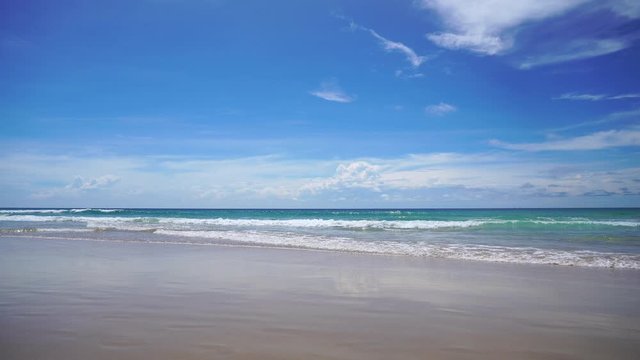 Beautiful tropical beach with blue sky and white cloud background. Summer vacation and nature environment concept.