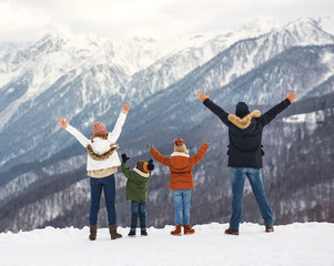 happy family mother father and children on winter nature  .