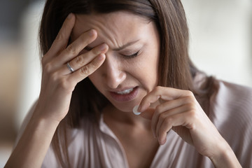 Sick woman suffer from headache taking pill