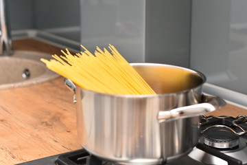 spaghetti in a bowl. Yellow long spaghetti, italian pasta. Long spaghetti. Raw spaghetti bolognese.