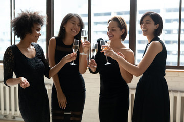 Smiling diverse girl in dresses celebrate bachelorette night