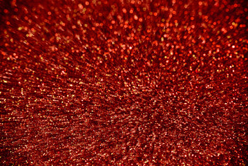 Rain of sparkling red particles in explosion like movement.