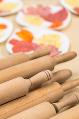 Wooden rocking chair for rolling dough. Pizza Cooking Concept. Vertical photo