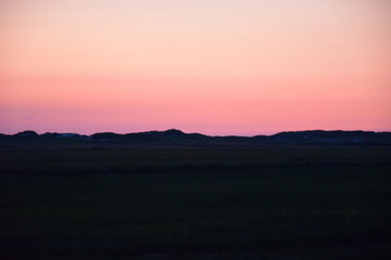 Sonnenuntergang hinter den Dünen 