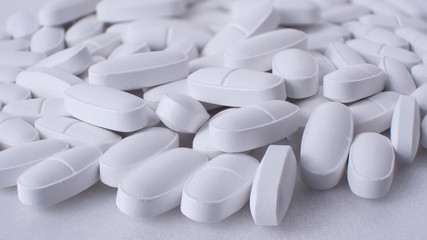 Fototapeta na wymiar calcium in tablets concept, white pills , macro, background