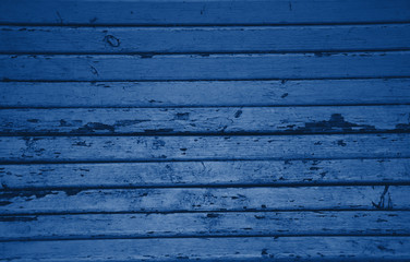 Obraz premium Texture of classic blue wooden boards. Grunge texture old wood. Classic blue color wood texture background surface with old natural pattern. Wood texture background, wood planks. Color trendy 2020.