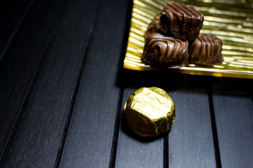 Various of sweet confectionery with chocolate candies and pralines. Handmade chocolates. Realistic chocolate set, delicious dessert pattern.