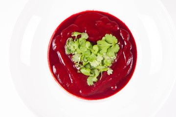 Beetroot cream soup with a heart made of coriander - a romantic treat