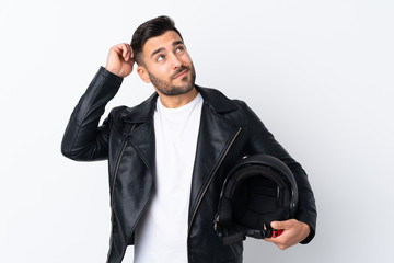 Fototapeta premium Man with a motorcycle helmet having doubts and with confuse face expression