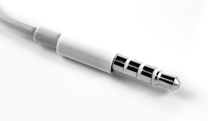 3.5 mm, mini jack, AUX cable on a white background closeup, macro