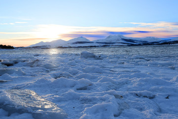 mountains with sea and ice