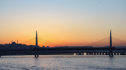 Beautiful view of the Golden horn bridge at sunset. Fabulous Istanbul.