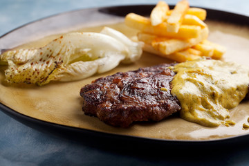 steak with sauce and potato