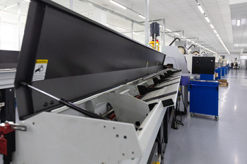 an interior shot of producing line of metal parts in modern plant