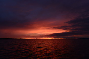 Fototapeta premium Twilight sky over the lake in bright colors of a sunset