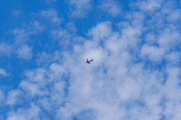 Commercial passenger airplane in the blue sky
