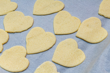 Hearts shape cookies cooking process. Valentines day gift preparation dating.