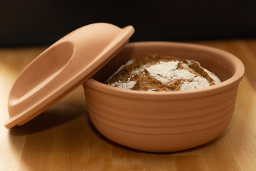 Homemade bread in a clay pot