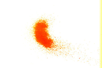 orange glitter powder and sand color splash or burst isolated on white