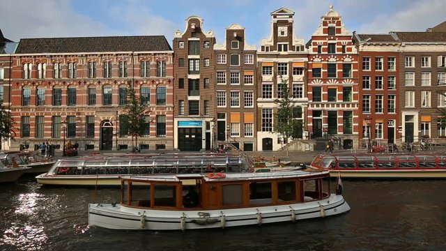 Typical Dutch Houses At Rokin Canal In Amsterdam, Netherlands