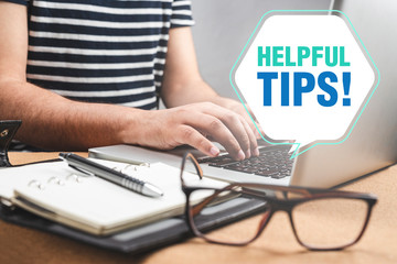 Cropped image of man working with his laptop with helpful tips text .