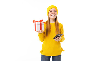 girl with a phone and a gift for Valentine's Day on a white background