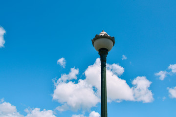 Lamp post against the blue sky