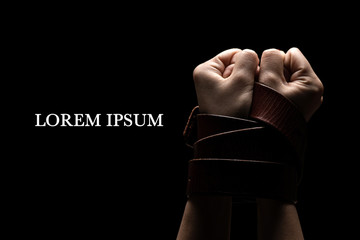 Woman tied up with leather belt in emotional stress and pain