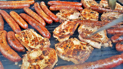grilling meat meat on a coal barbeque