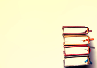 small books on a white background