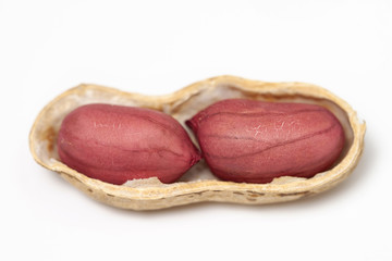 Peanuts in the shell two nuts macro isolated white background