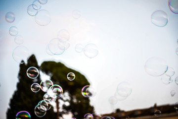 soap bubbles within the italian streets in Rome