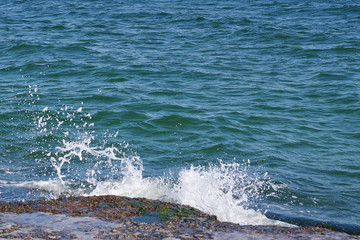 turquoise waves rolling on the sandy seashore