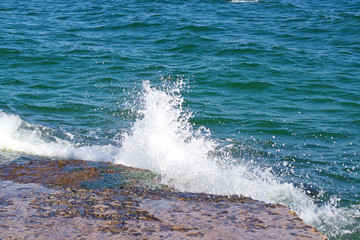 turquoise waves rolling on the sandy seashore