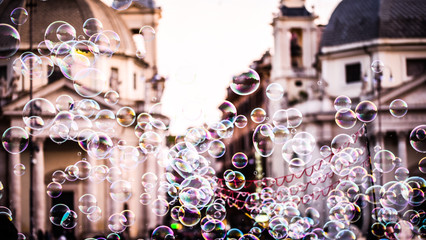 soap bubbles within the italian streets in Rome