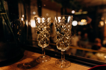 two crystal glasses festive champagne blur light