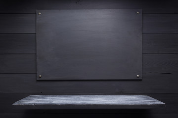 wooden shelf at black background