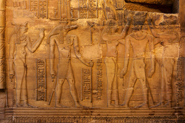 Fototapeta premium Hieroglyphic carvings on the exterior walls of an ancient egyptian temple