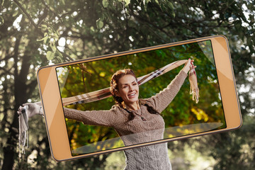 Photo of pretty woman posing with scarf, demonstration of device capabilities