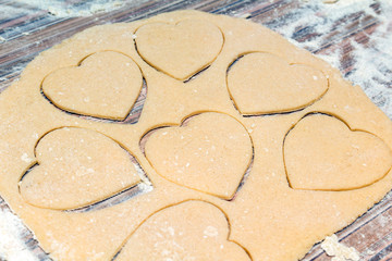 Hearts shape cookies cooking process. Valentines day gift preparation dating.