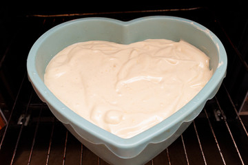 Heart shape cake cooking process. Valentines day gift preparation dating.