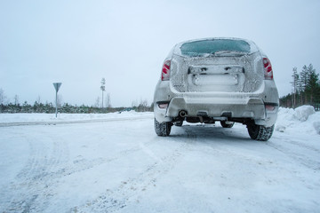 Karelia, Russia - January, 6, 2019: Car on a snowy road in Karelia, Russia