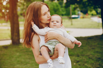 Fototapeta premium Mother with a baby. Walking in the park. Family relationship.