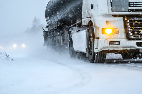 truck on a highway in Karelia during heavy snow