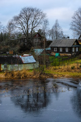 Fototapeta premium country houses on a bank of Volhov river in Volhov, Russia