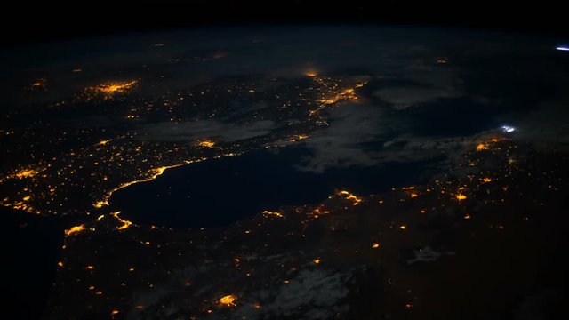 Time lapse of the planet earth from SIS. City lights at night. Morocco, Strain of Gibraltar, Portugal, Spain and north of Italy visible.  Elements of this image courtesy of NASA Johnson Space Center :