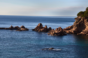 Rocky line protruding from seawater